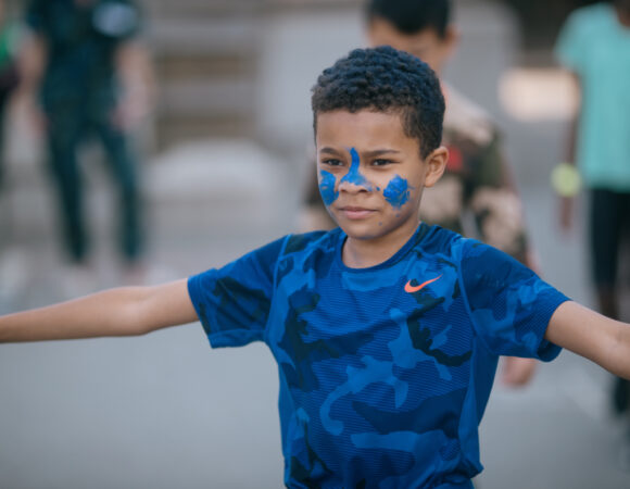 WCRA portrait of a student with blue face paint